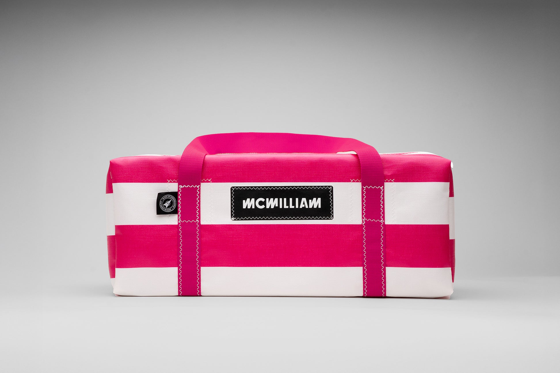 Pink and white bag with 'MCWilliam' branding on a gray background