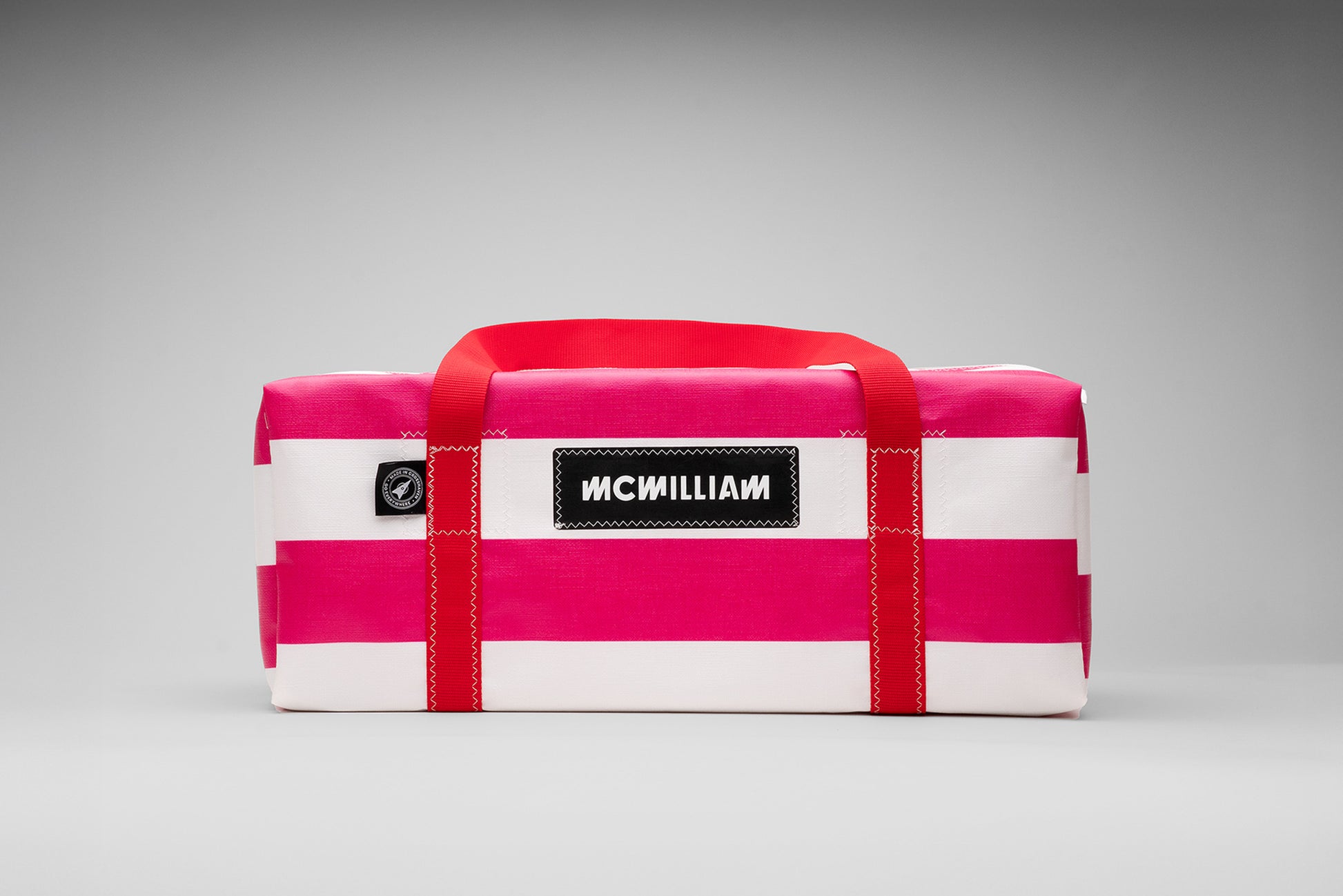 Pink and white bag with 'MCWilliam' branding on a gray background